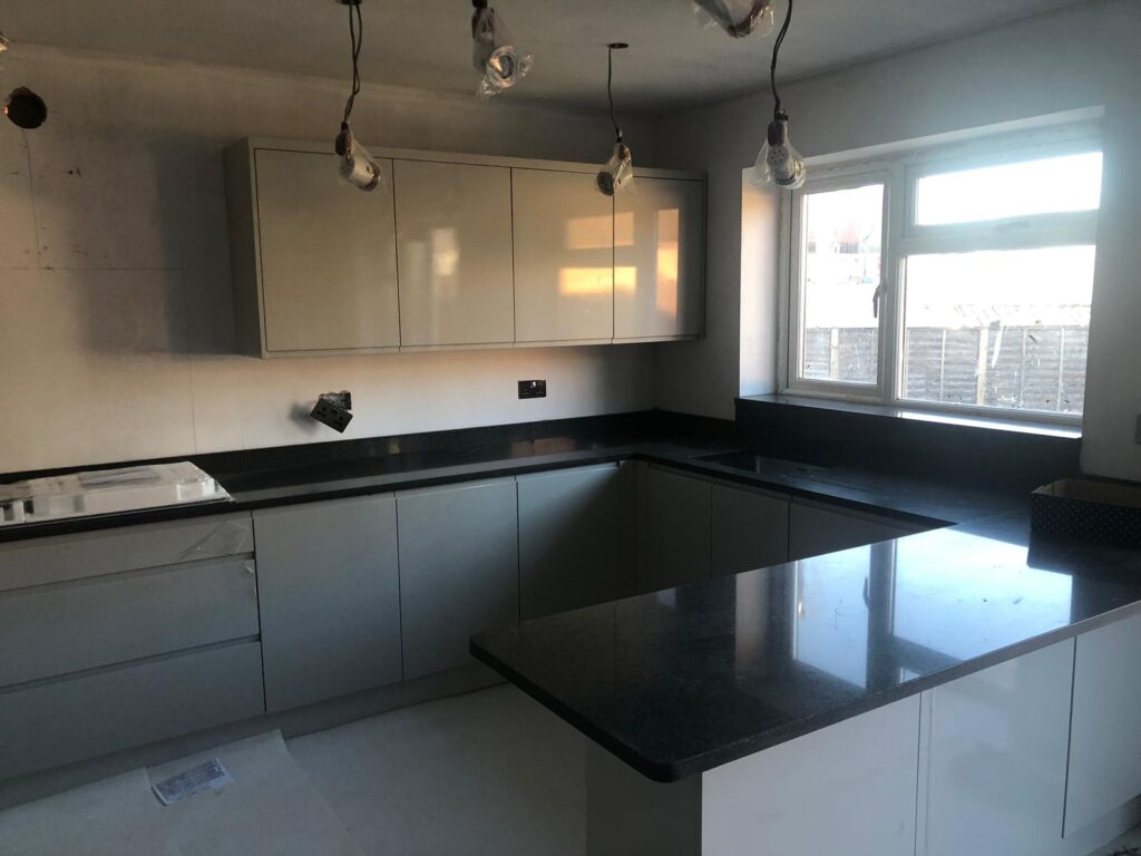 Kitchen with dark stone island